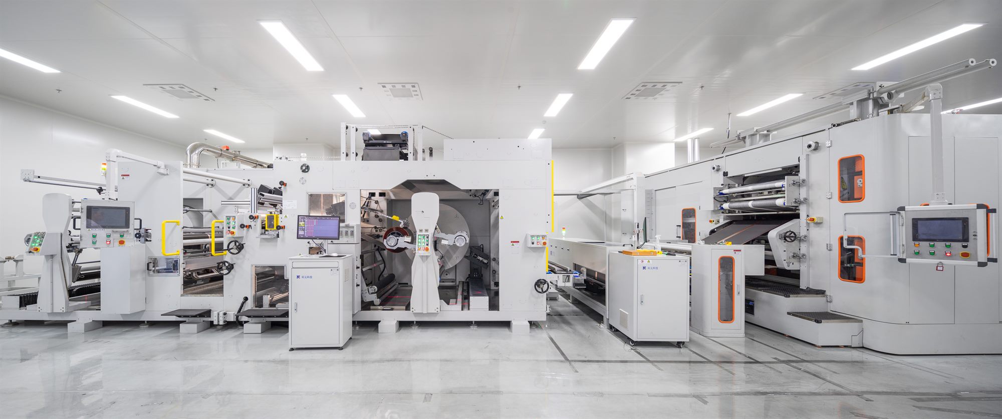 Automated battery production machinery in a bright clean room, Shihlien New Energy plant
