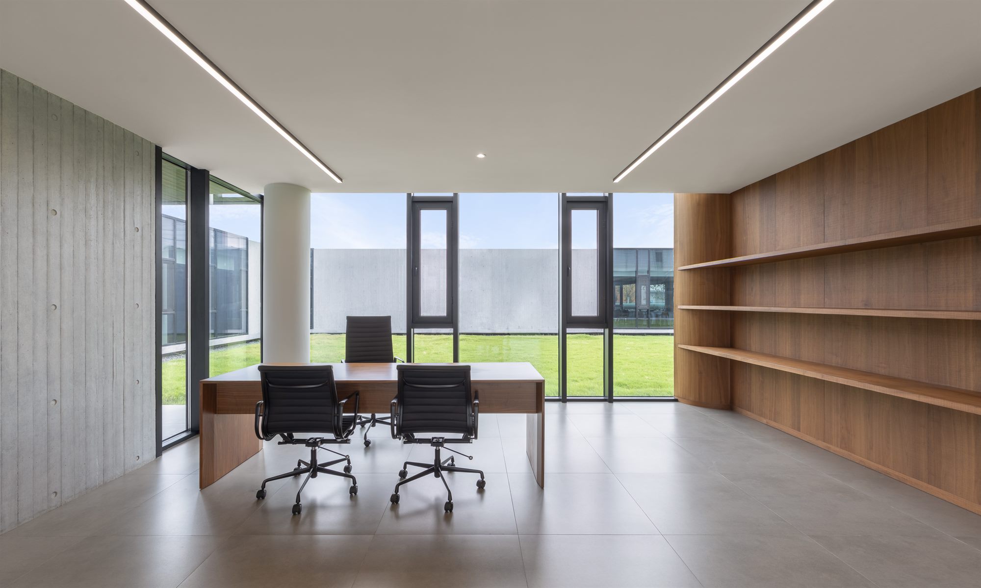 Executive office with timber wall shelving and courtyard views, Shihlien battery plant