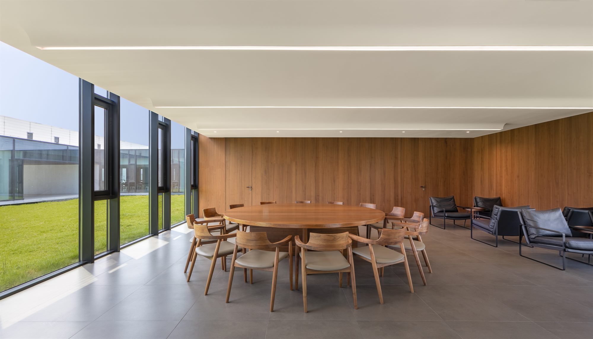 Executive dining room with round table and garden views, Shihlien battery plant office