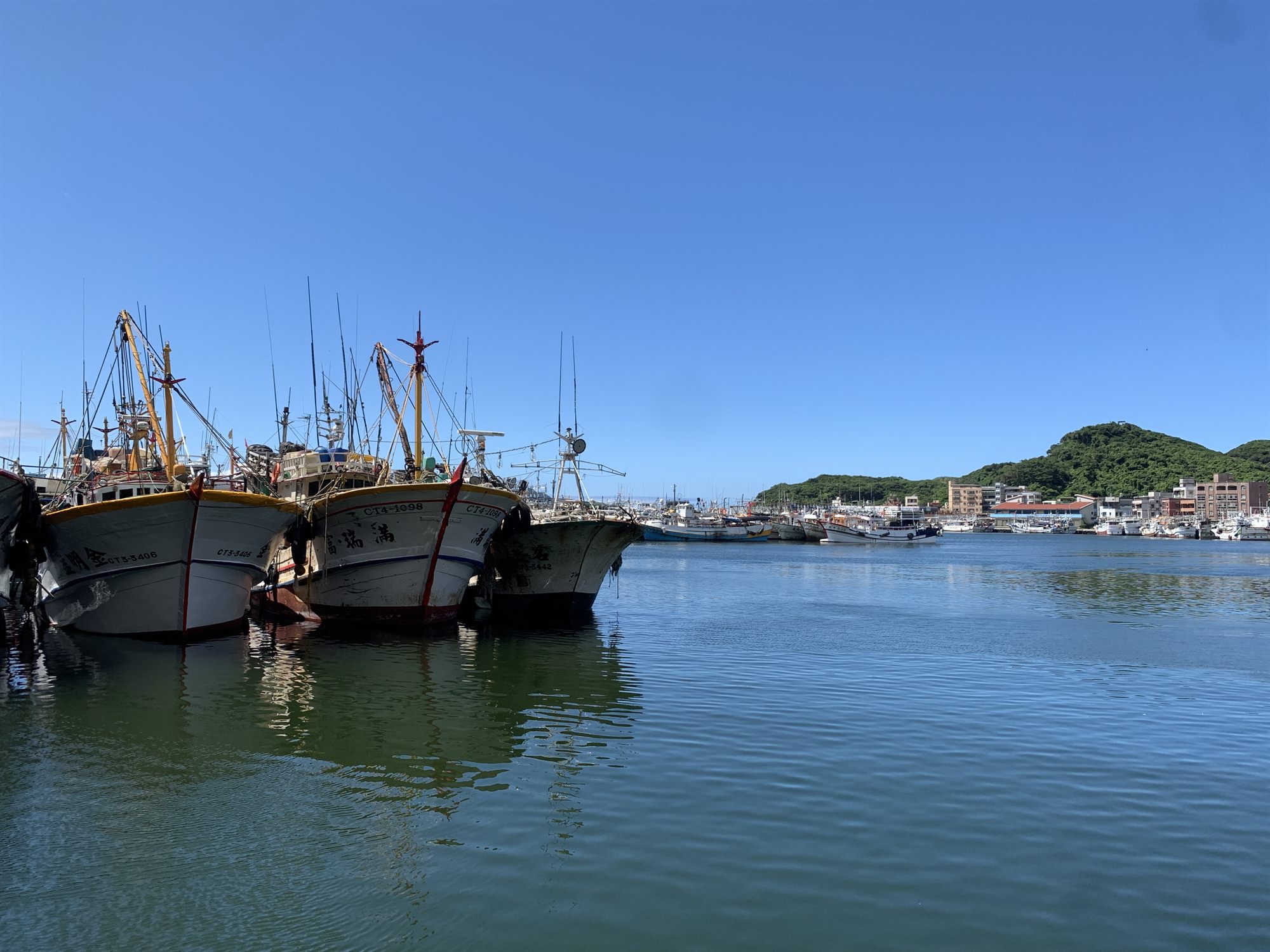 Fishing boats moored at Badouzi Harbour, Keelung, beside the commercial centre site