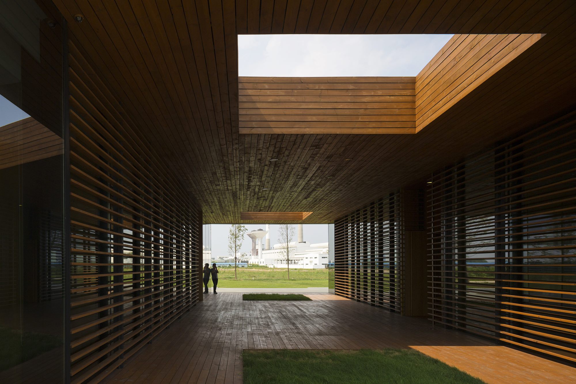 Covered courtyard passage with a timber-lined opening, Donghai office building