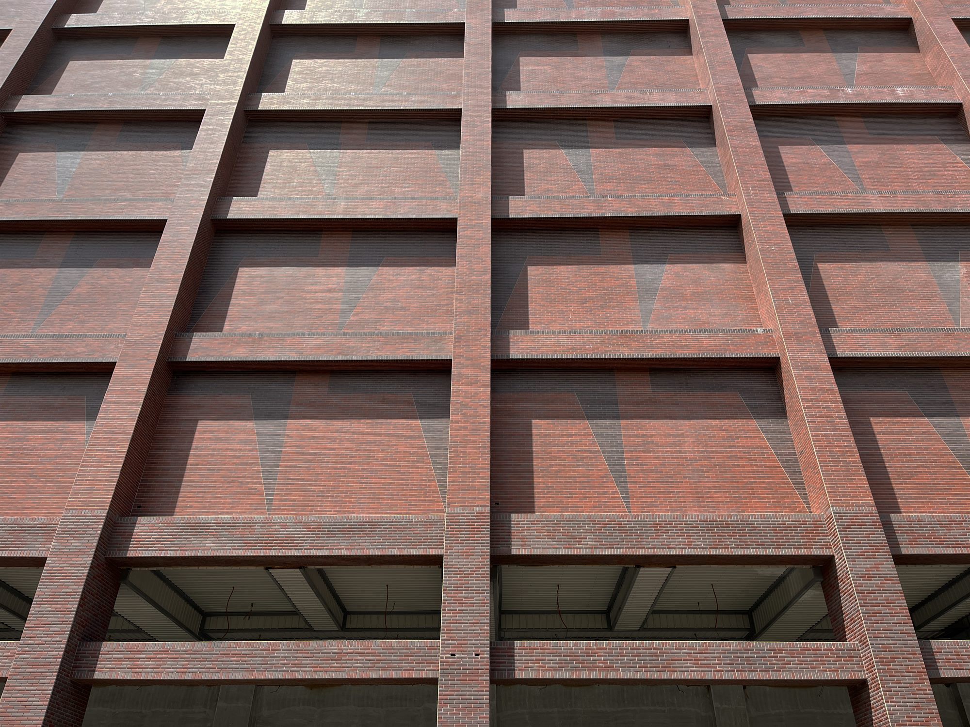 Red-brown grid façade of the HPW cold storage building