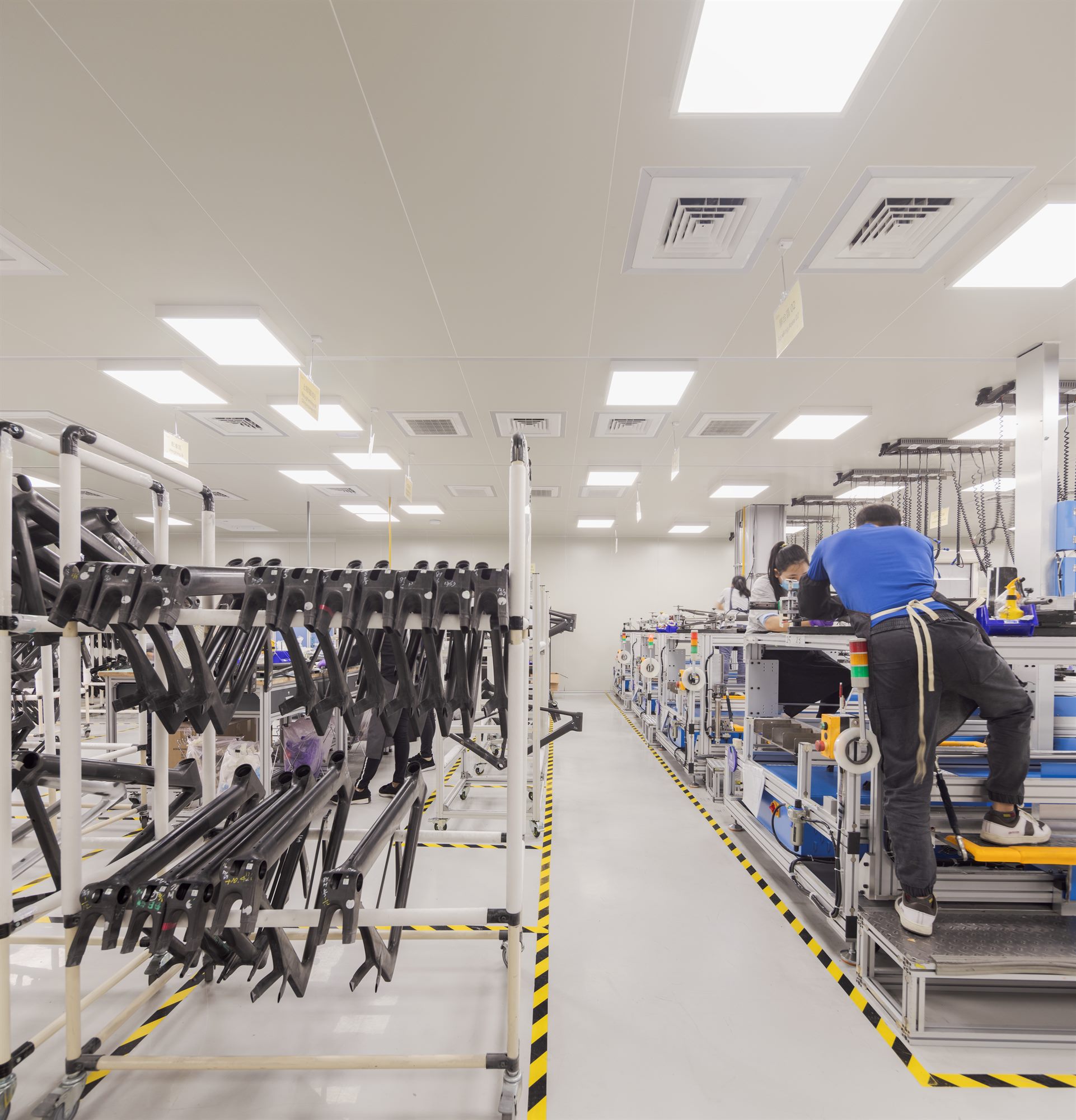 Carbon bicycle frame production line with workers, Quest Composite factory