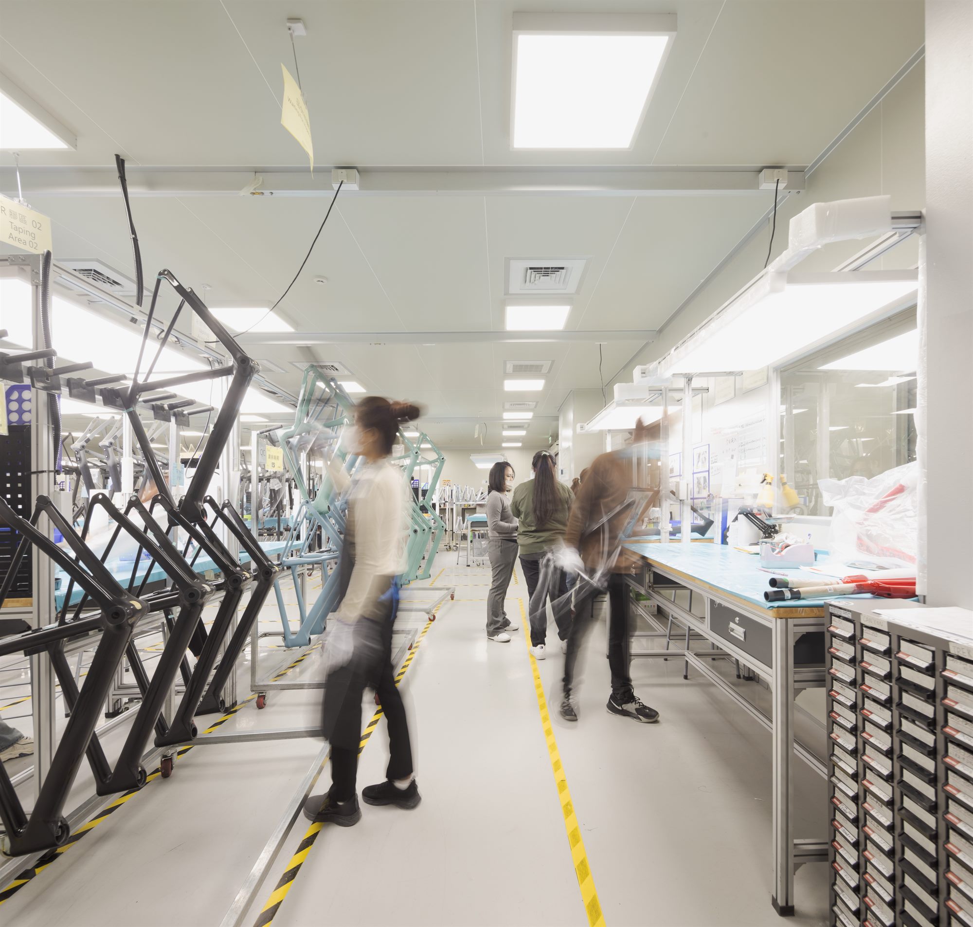 Workers on the carbon bicycle frame assembly line, Quest Composite factory
