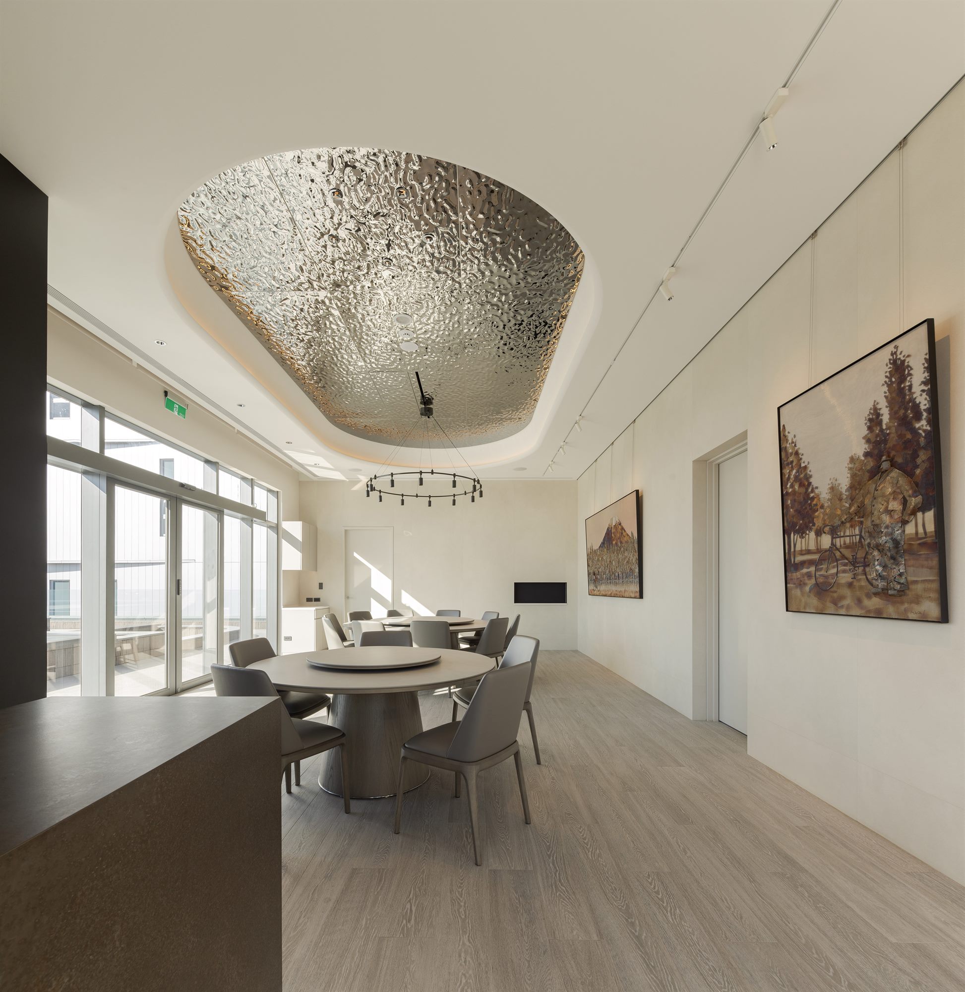 Executive dining room with oval ceiling light and artwork, Quest Composite