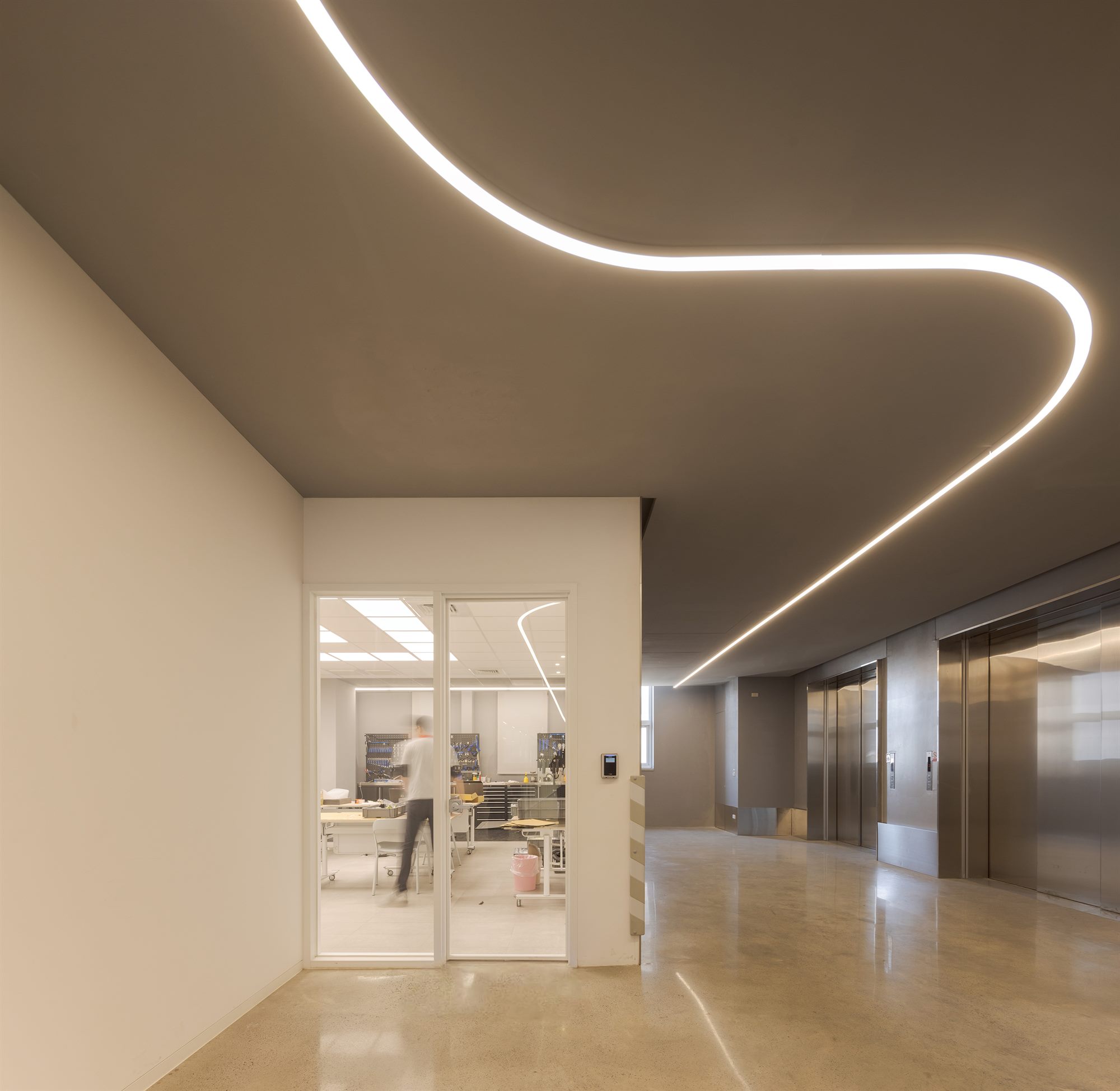 Strip lighting symbolising speed and efficiency in the factory corridor, Quest Composite
