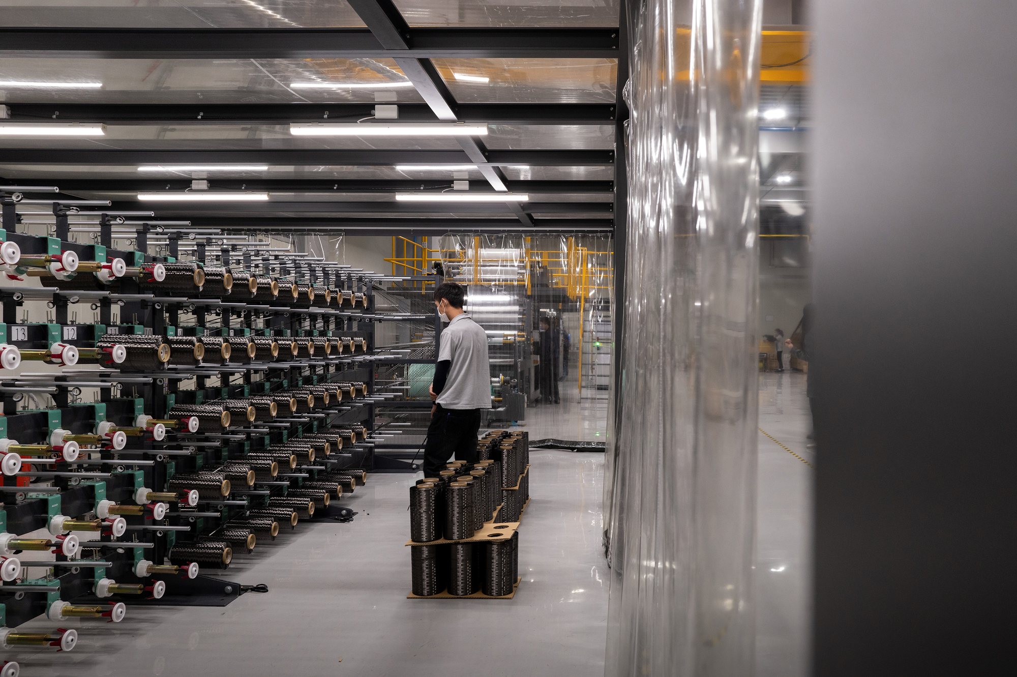 Carbon fibre being produced on racks in the production hall, Quest Composite factory