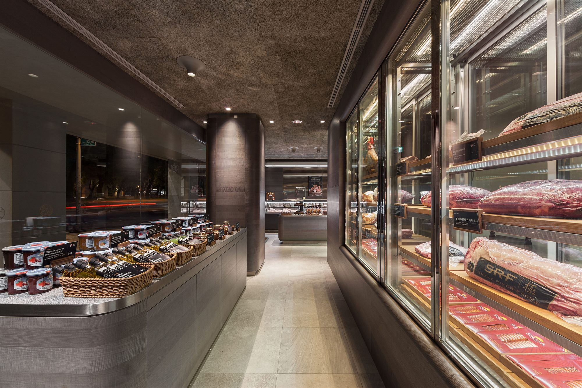 Glass-fronted meat display cabinets along the butchery counter, ROU by T-HAM