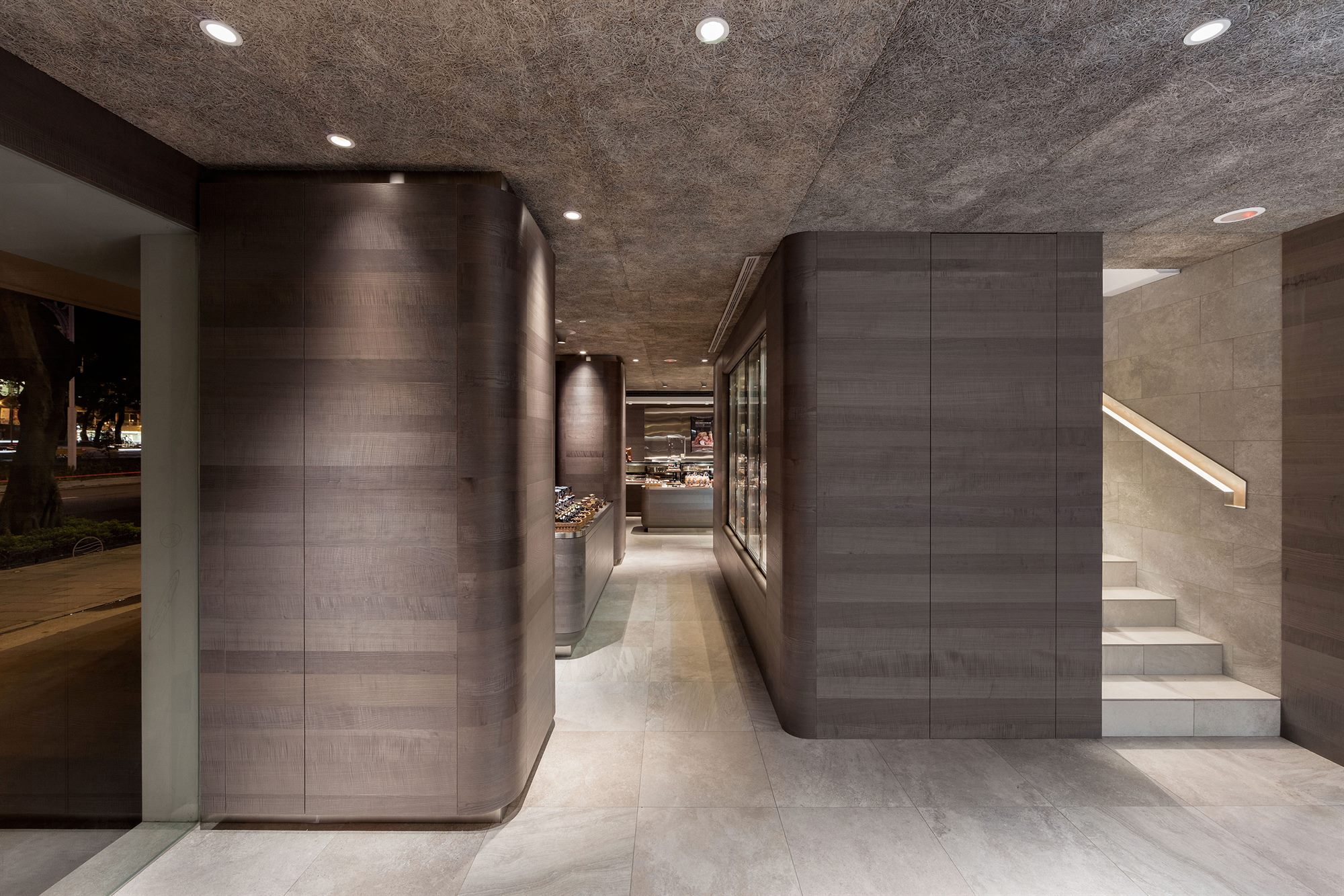 Grey-toned timber wall panels and stone floor, ROU by T-HAM concept store