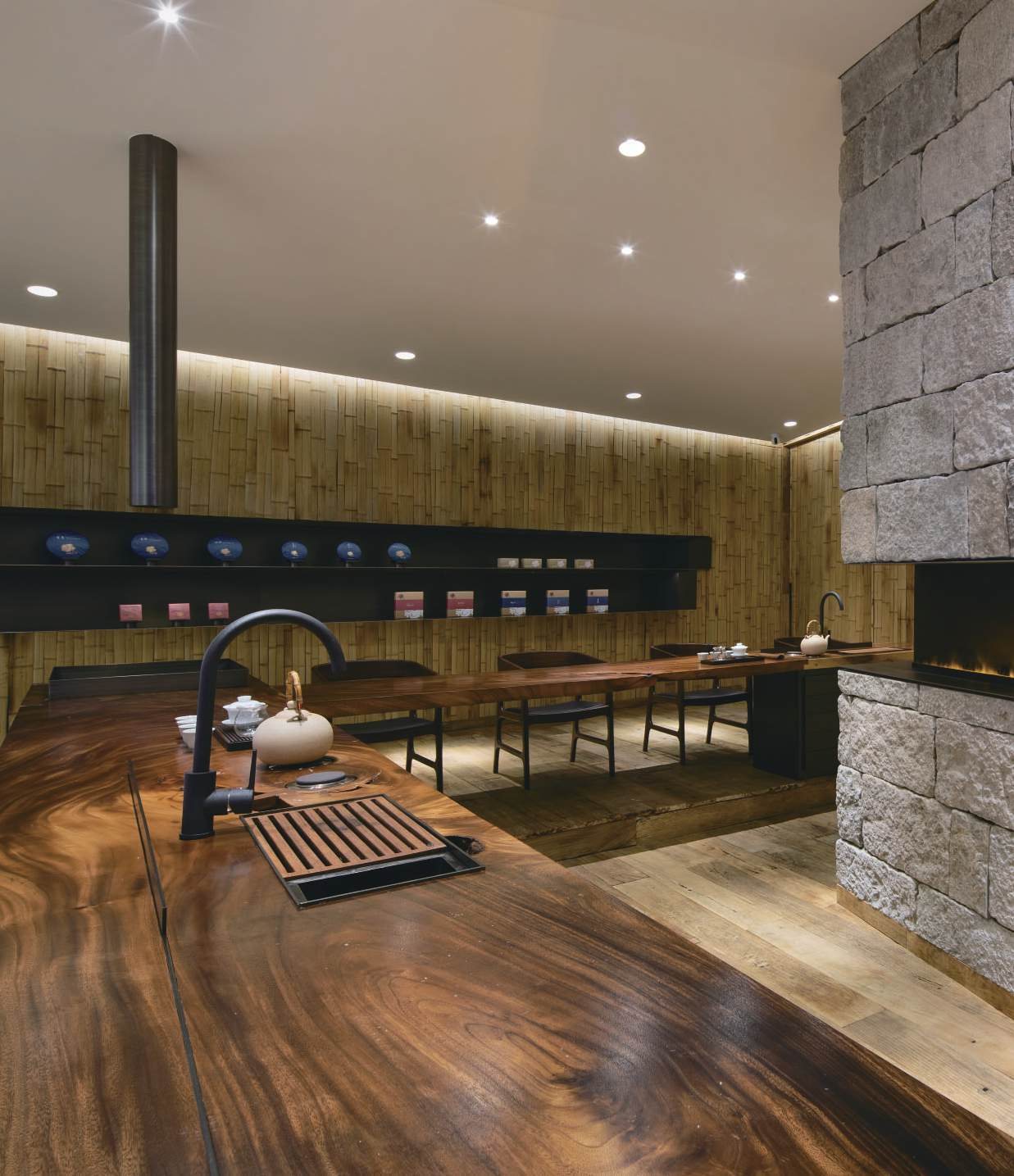 Tea table, stone hearth and flattened bamboo walls, Shan Tea concept store