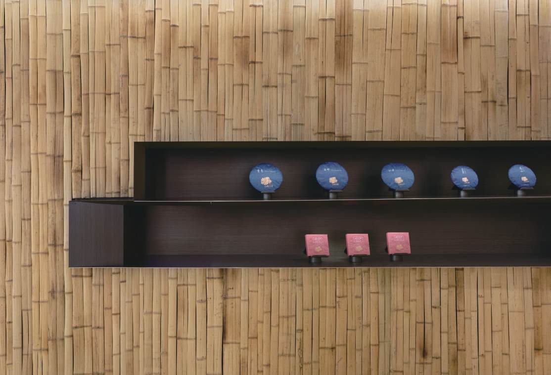 Flattened bamboo wall with a recessed shelf for tea ware, Shan Tea concept store