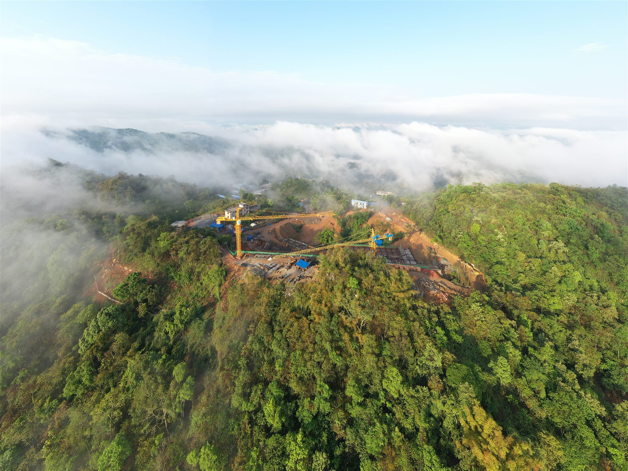 Aerial view of the hilltop Shan Tea site above a sea of clouds, Yunnan