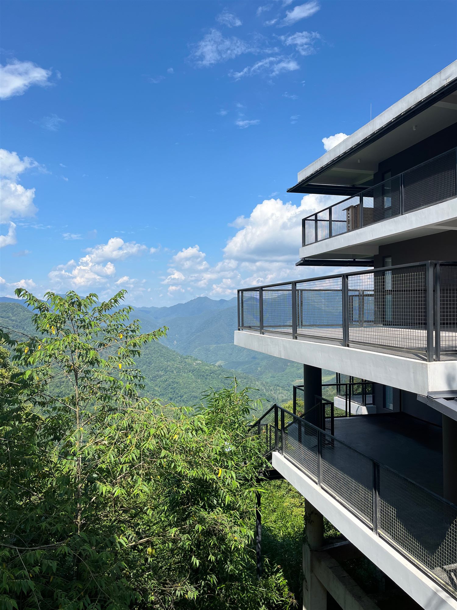 Stacked balconies of the Shan Tea factory overlooking the valley