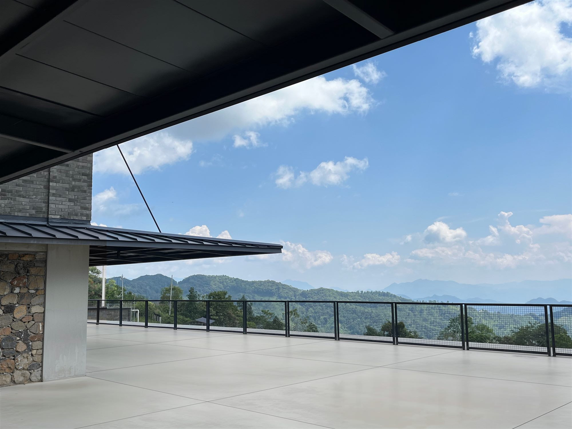 Roof terrace with deep overhang and mountain views, Shan Tea factory