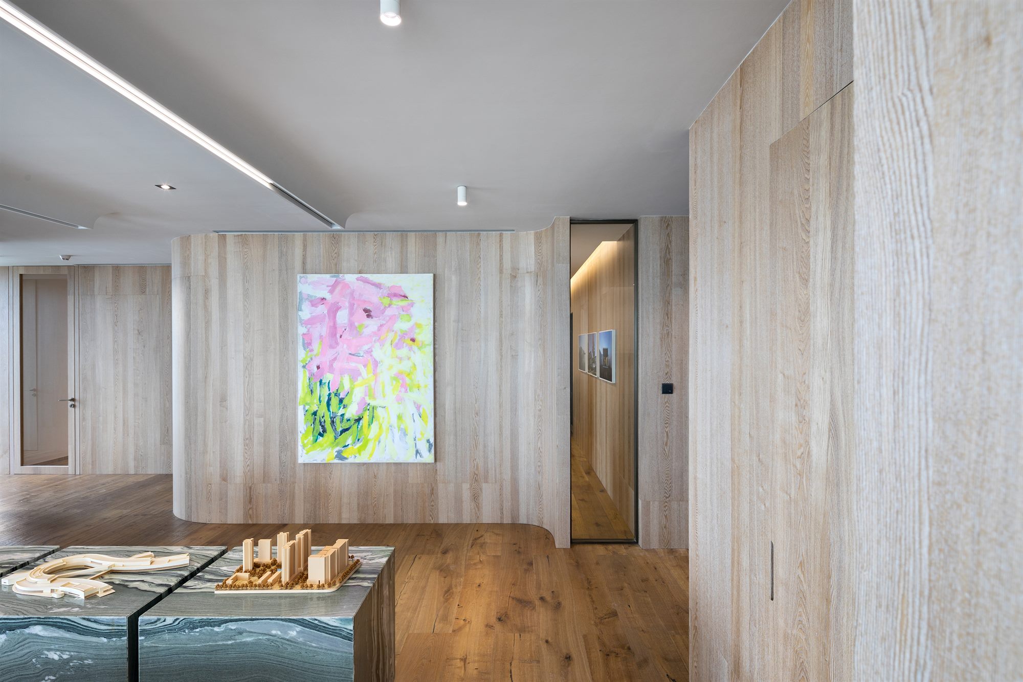 Reception lounge with oak walls and wooden floor, Shenzhen Wenhua Architectural Construction office