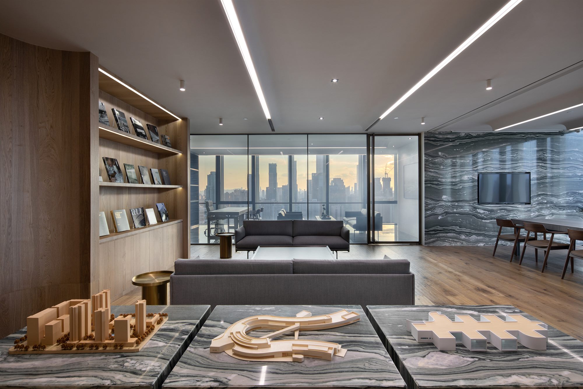 Lounge with bookshelves and full-height windows, Shenzhen Wenhua Architectural Construction office