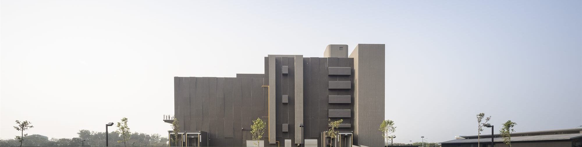 Side elevation of the T-HAM factory, its carefully coordinated MEP elements reading as ornaments on the façade
