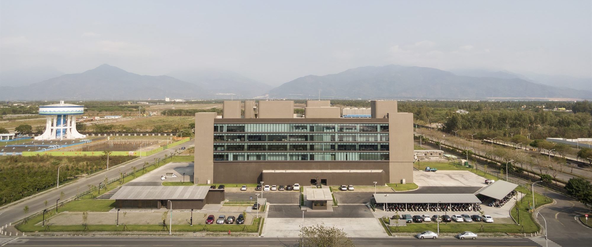 Aerial view of the T-HAM factory campus with mountains in the distance