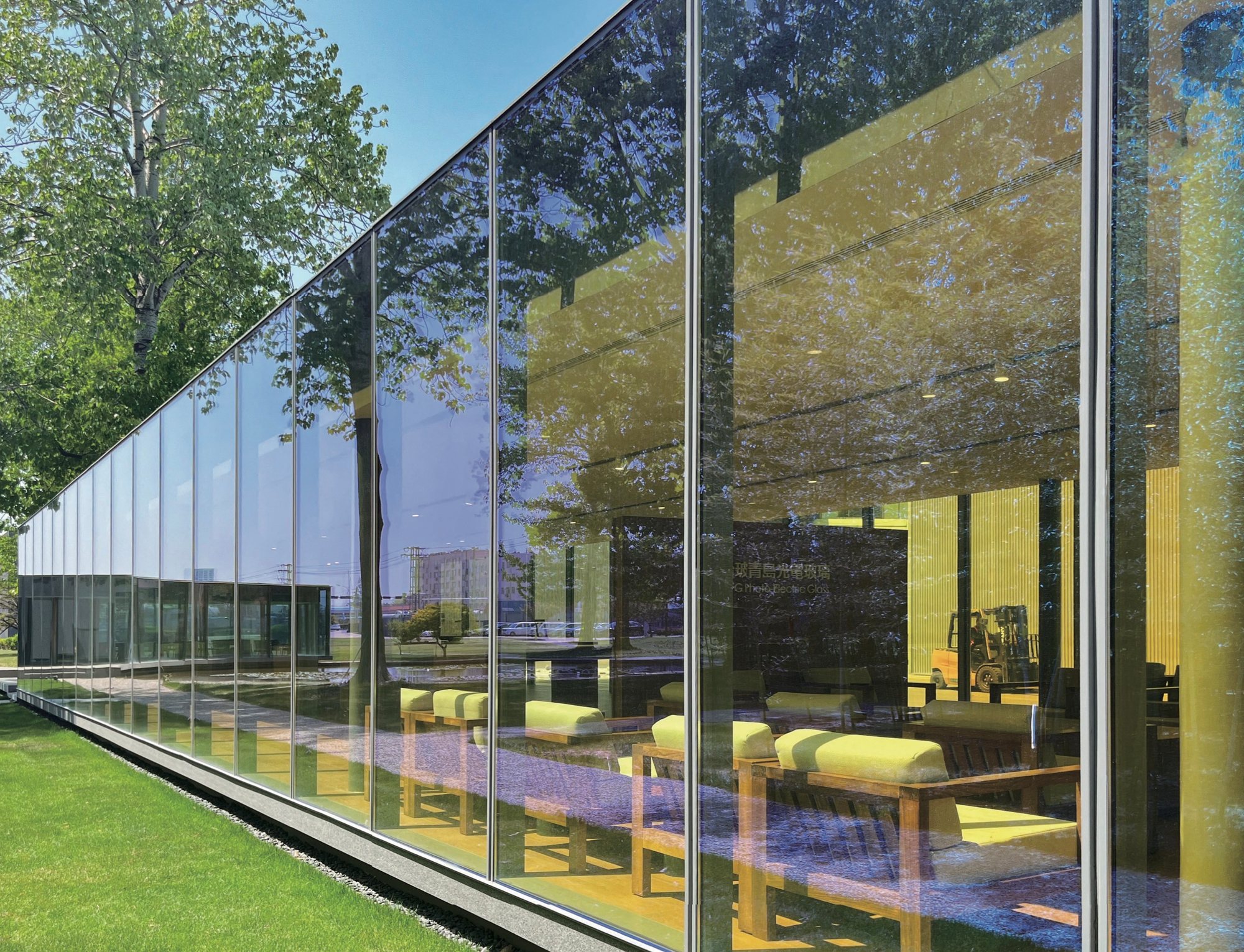 Dichroic glass panels glowing yellow along the Taiwan Glass showroom