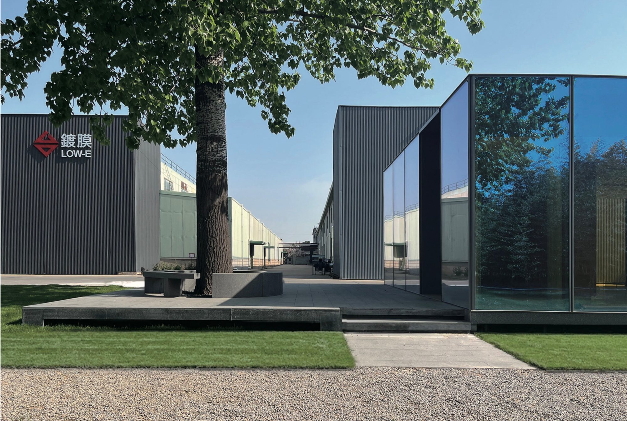 Dark glass showroom entrance with the Taiwan Glass logo, Qingdao
