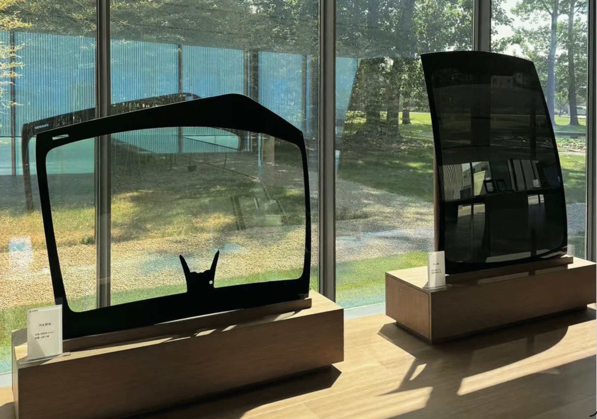 Curved automotive glass samples on display inside the Taiwan Glass showroom