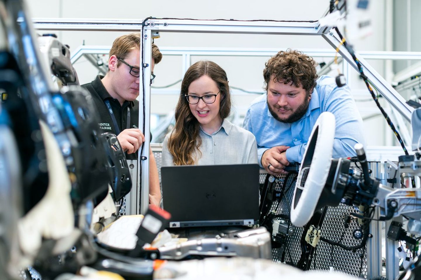 Engineers working beside a robotic rig