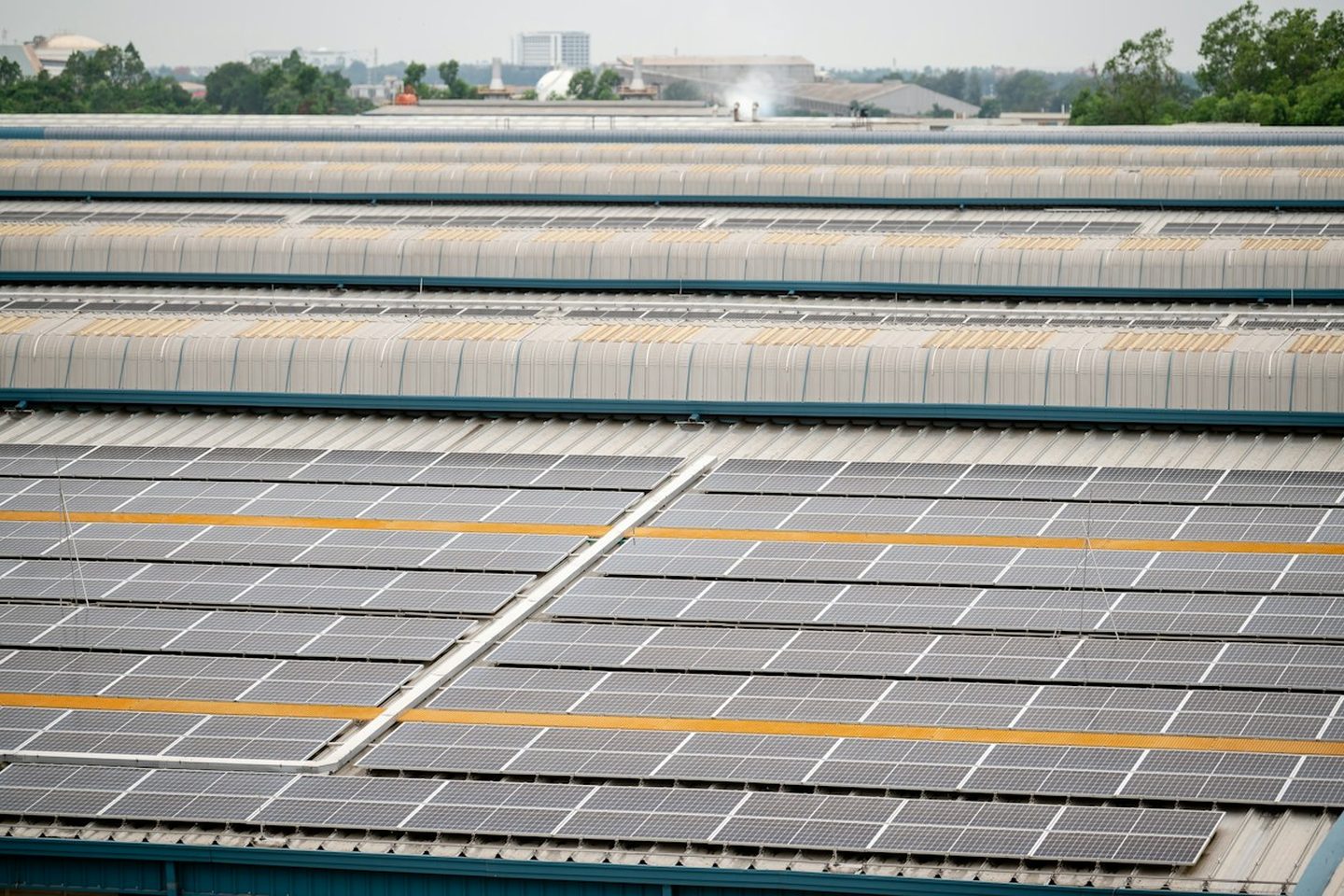 Solar panels covering a factory roof