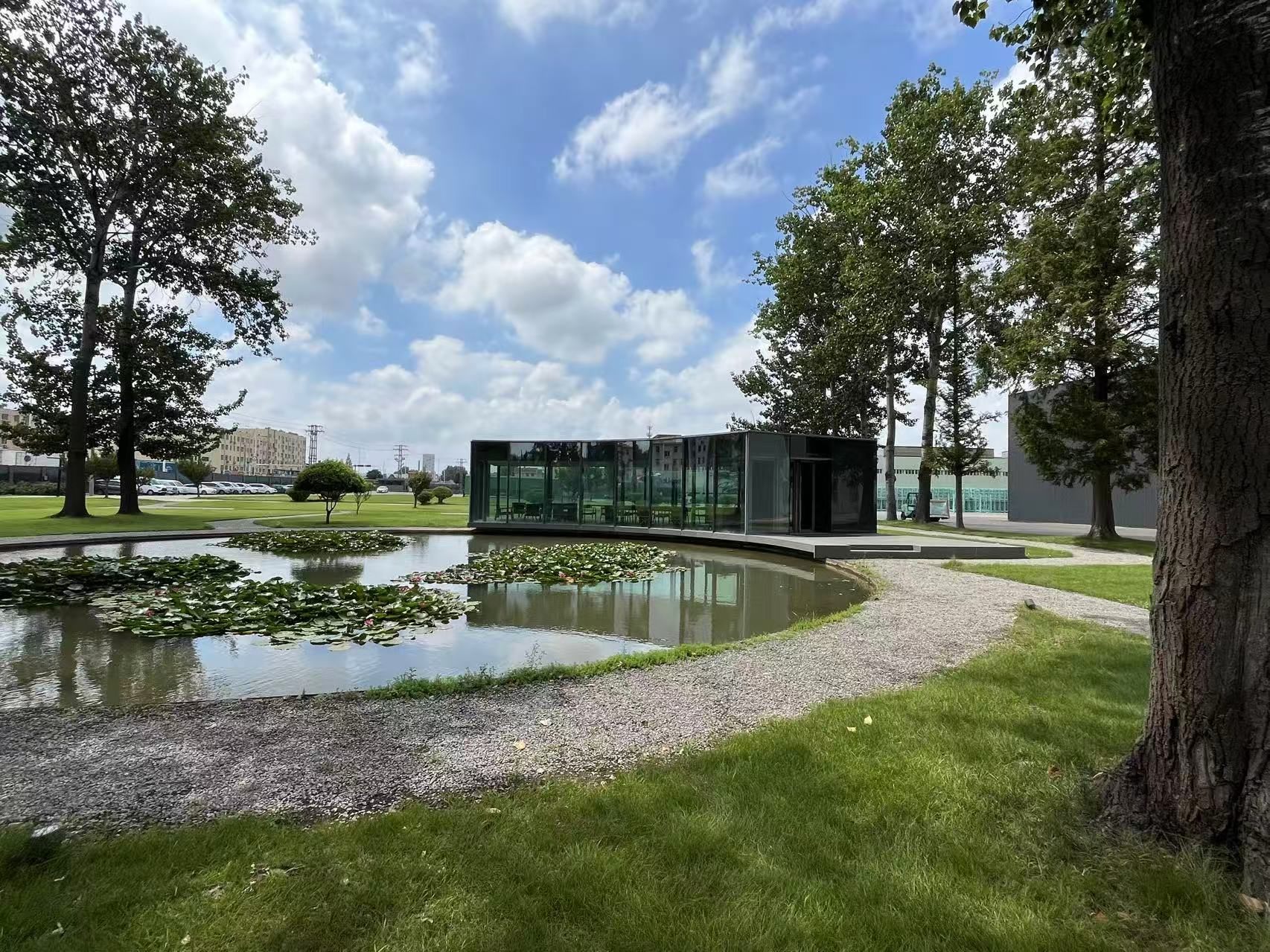 Vacuum glass pavilion beside a lily pond in the Taiwan Glass factory garden, Qingdao