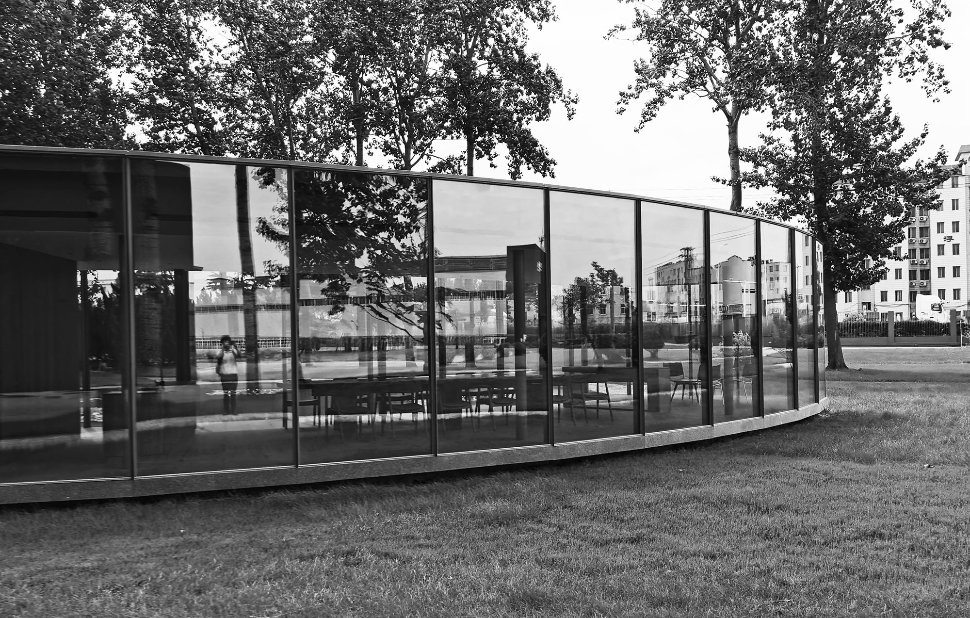 Vacuum glass pavilion among trees in the Taiwan Glass factory garden, Qingdao